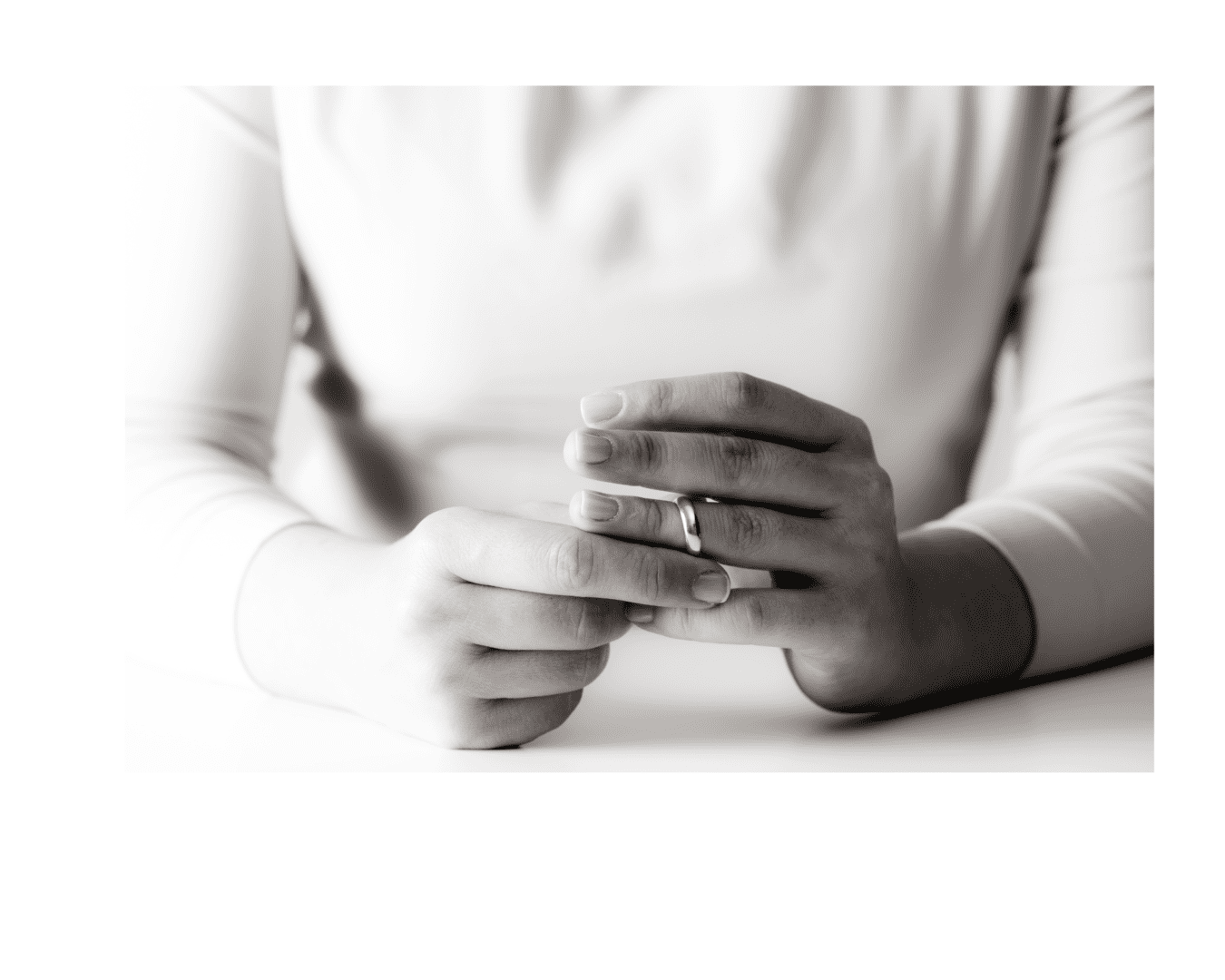 Black and white image of a lady wearing a ring