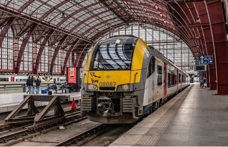 A yellow color train running at the platform