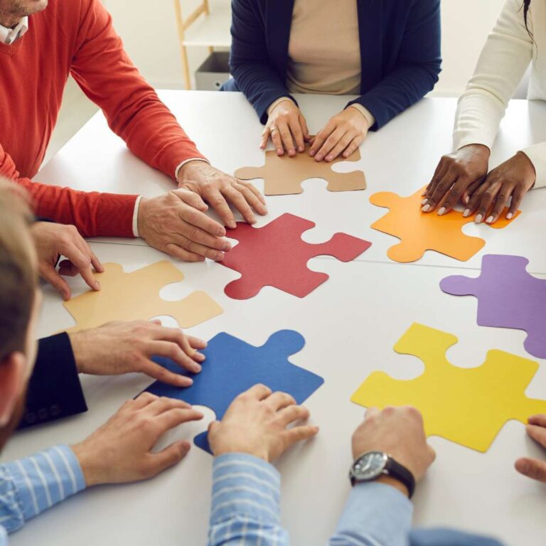Adults with puzzle pieces