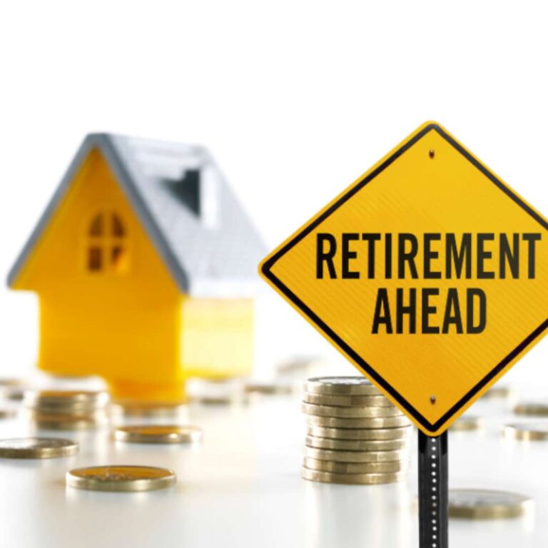 Yield sign showing "retirement ahead" with stacks of coins and a home in the background