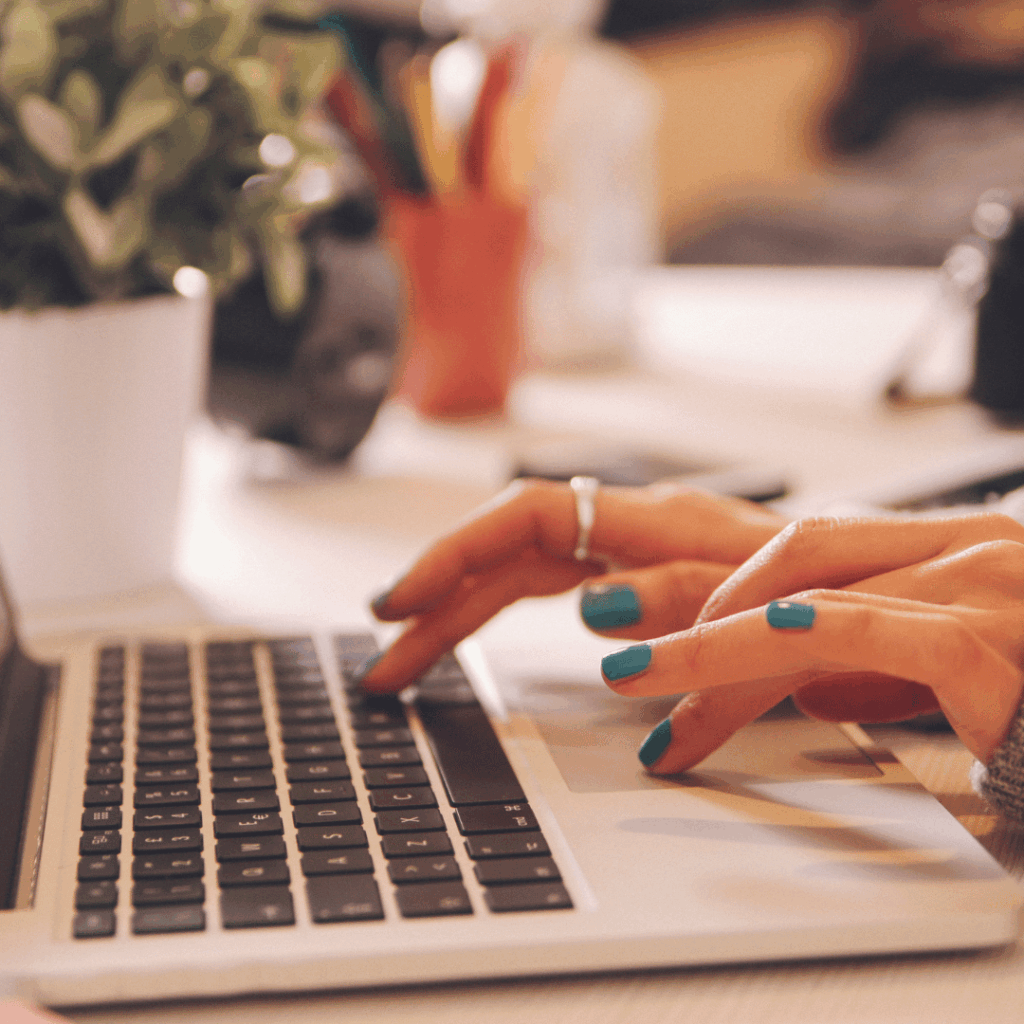 Woman's hands on laptop keyboard